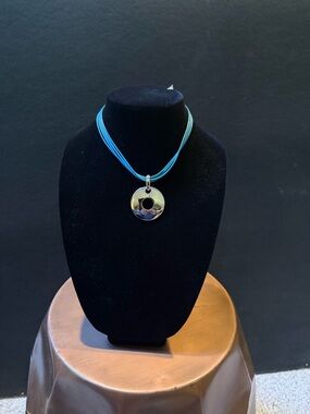 Source Unknown Silver Ring Pendant on Aqua Multi-Strand Cord